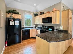Seaglass Village Unit 182: 2BR in Wells, featuring a King bed and bunk beds for 4 guests. - Image 4