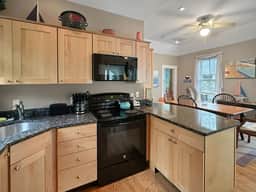 Seaglass Village Unit 182: 2BR in Wells, featuring a King bed and bunk beds for 4 guests. - Image 3