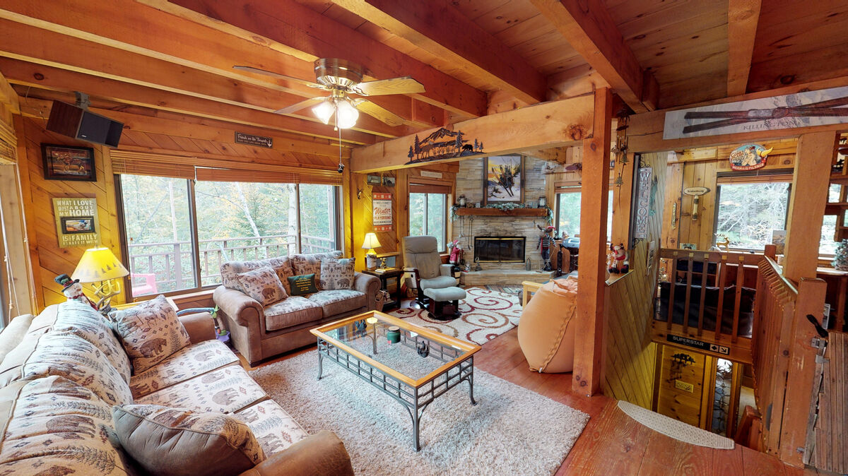 The Living Room with Fireplace in One of Our Large Group Rentals in Killington.